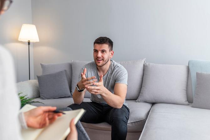 Young White Male Speaking to Therapist