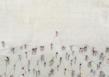 Aerial view of a group of people connecting and supporting one patient.